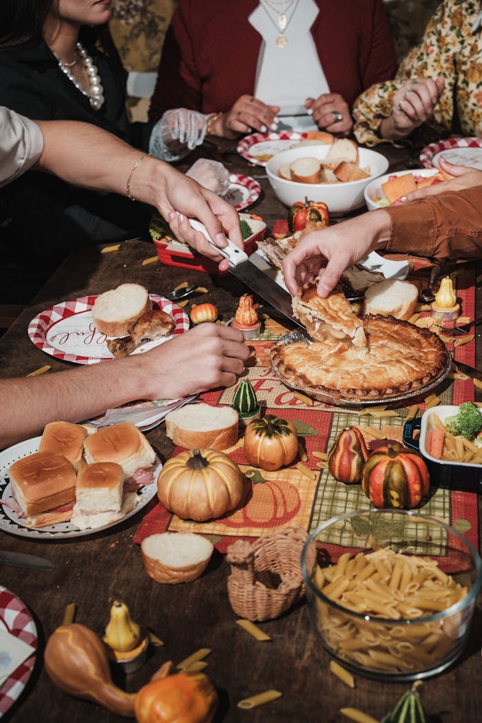 gallery-3 A cozy Thanksgiving family dinner with festive decorations and traditional dishes on the table.